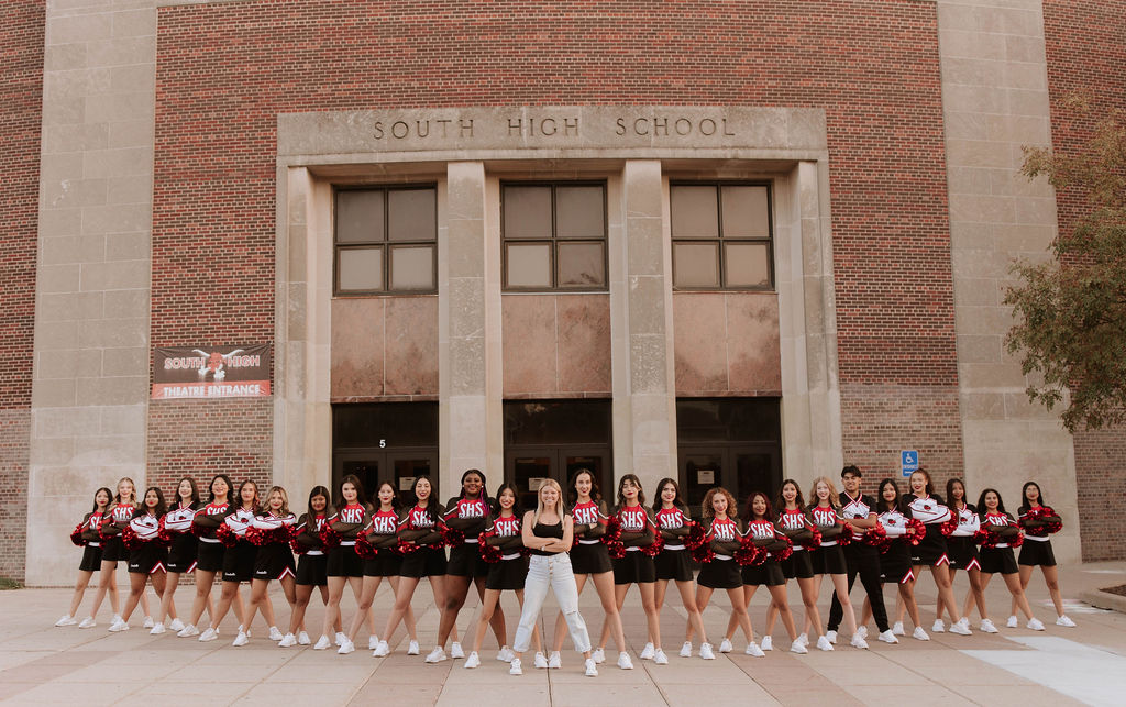 Kimberly Synowiecki stands with the 2023-24 Luvabulls dance team.
