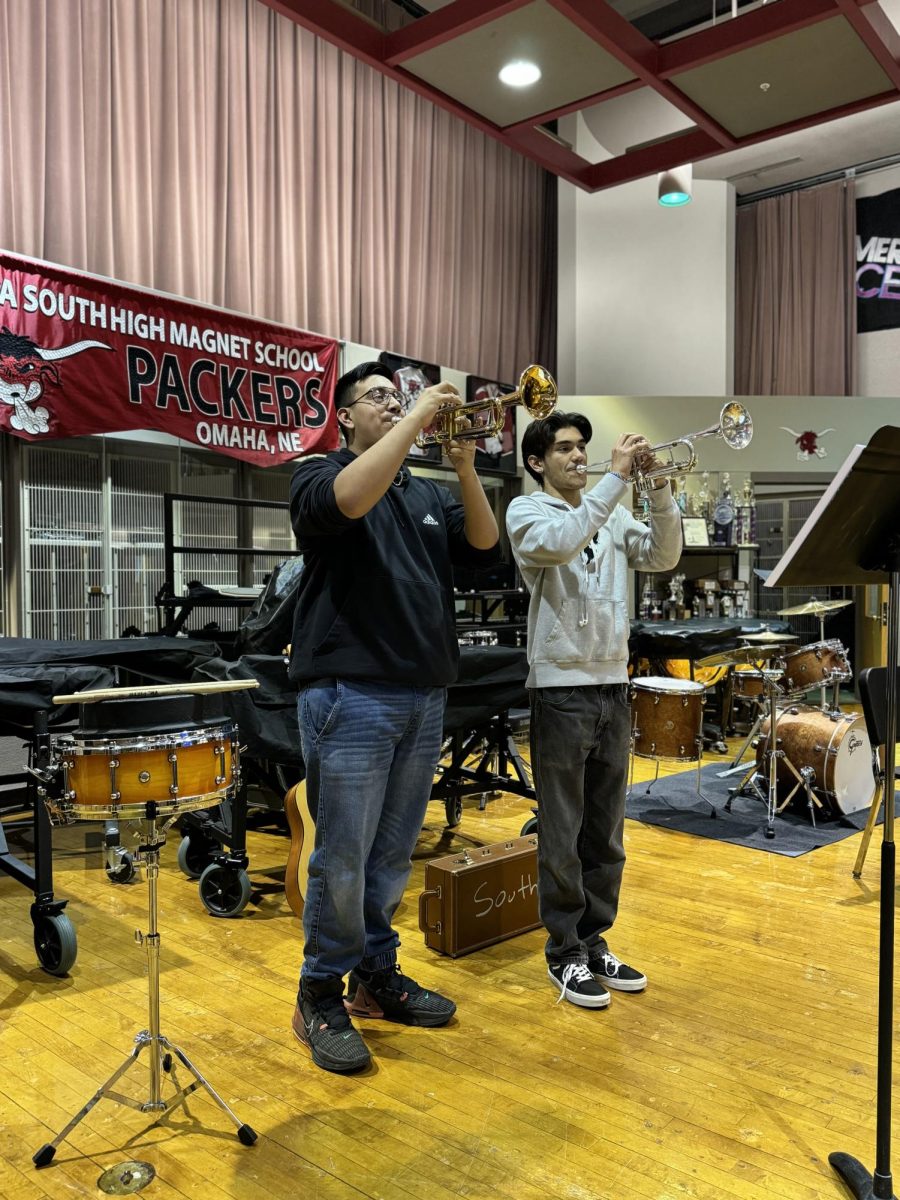Club members Brandon Castro and David Garcia demonstrate their musical talents.