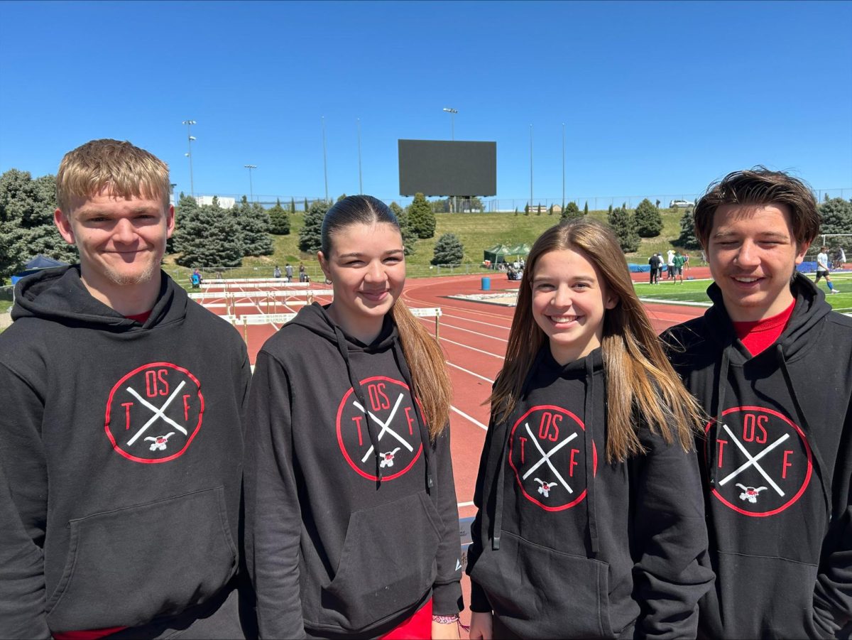 Soaking up their success are track members Leland Bishop, October Kochen, Charlotte Gregor and Xander Kochen.