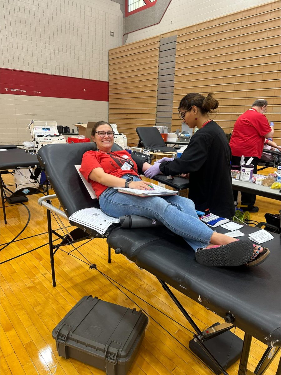 Foreign language teacher Erin Leger gives back by donating blood.