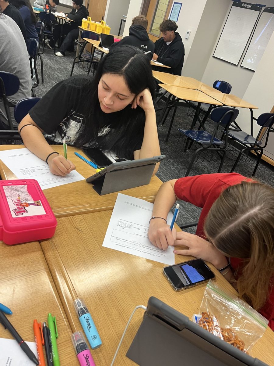 Seniors Patricia Trujillo and Mackenzie Burke Wilson struggle to finish math homework.