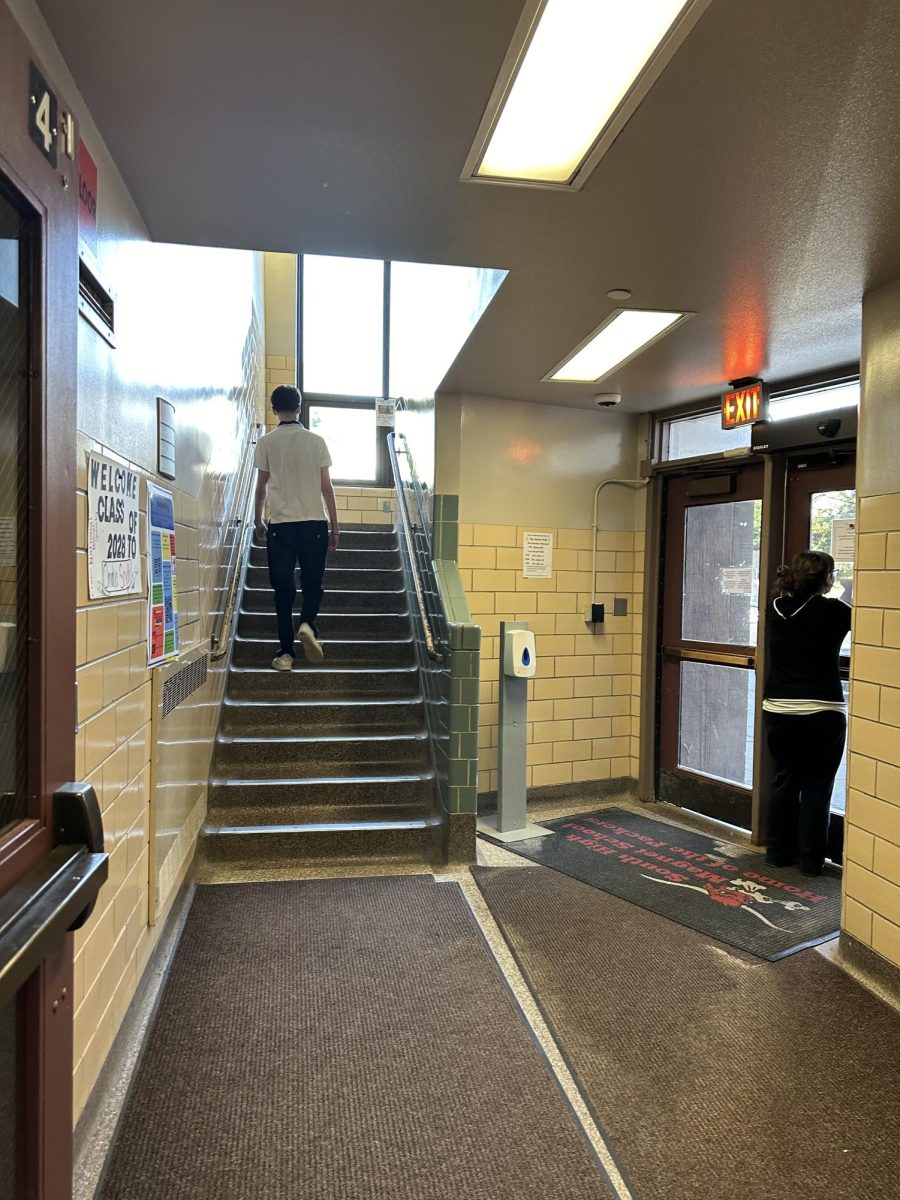 One student heads to class while another thinks about their work schedule.