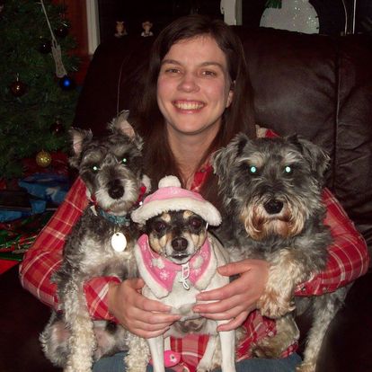 Allison DeGraw snuggles with some pups, above.