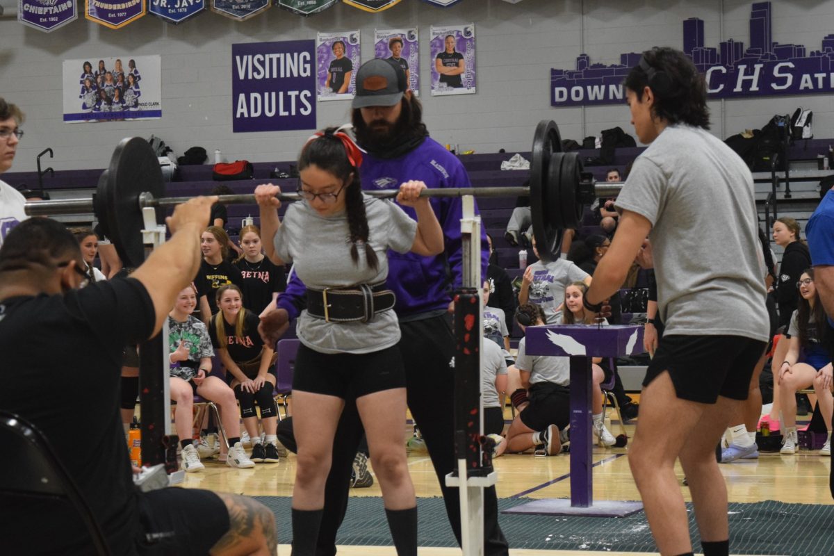 Senior Mariamne Miranda-Becerra pushes her limits to hit her squat personal record.  