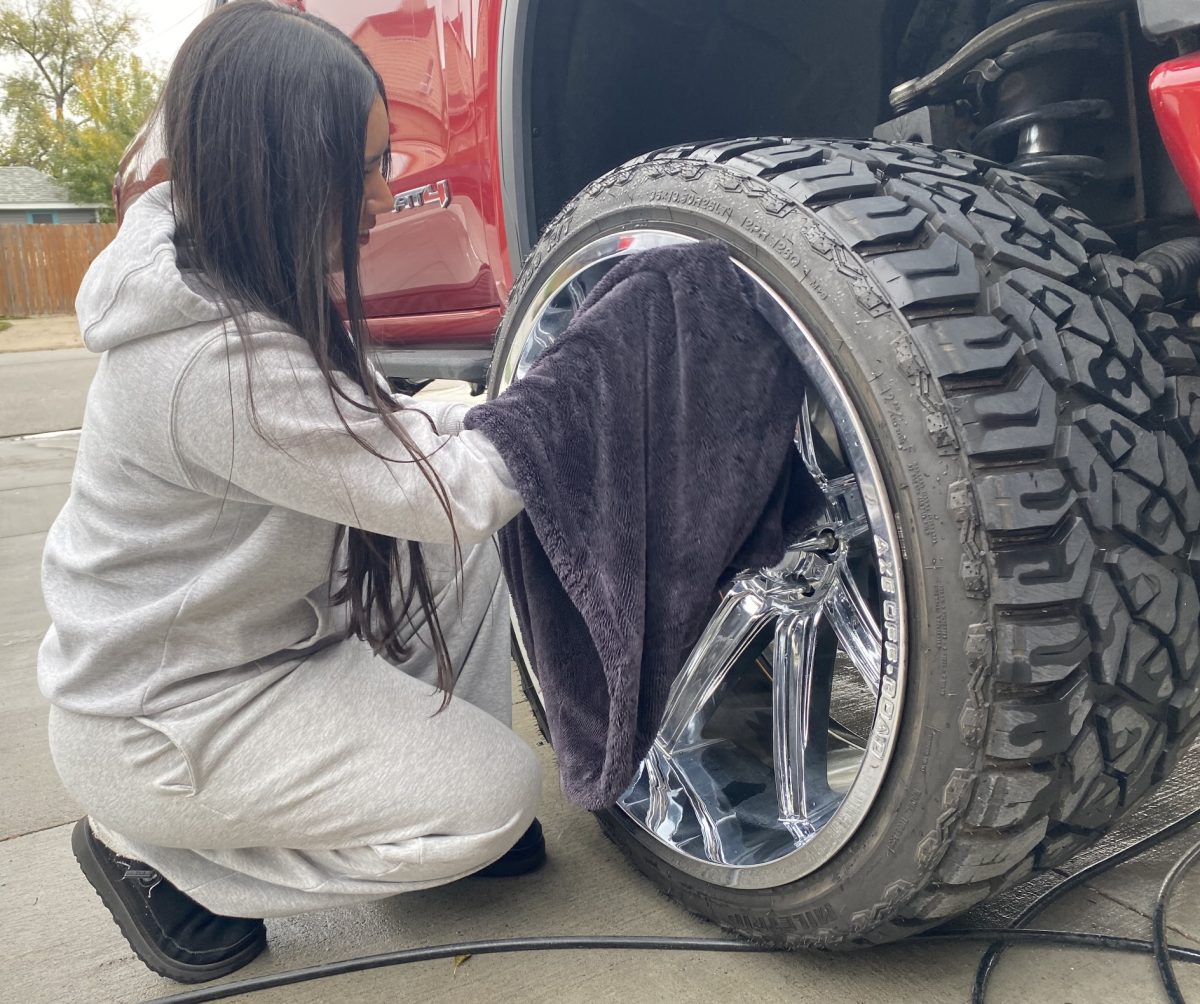 Senior Elizabeth Hernandez Ortega uses her free time to clean her truck.