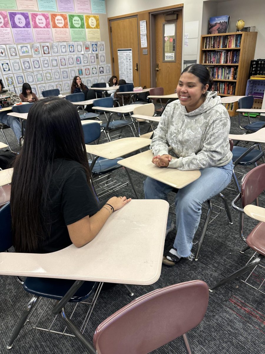 Seniors Yazlin Lopez and Destiny Rodriguez Cabeza discussing about upcoming activities for seniors