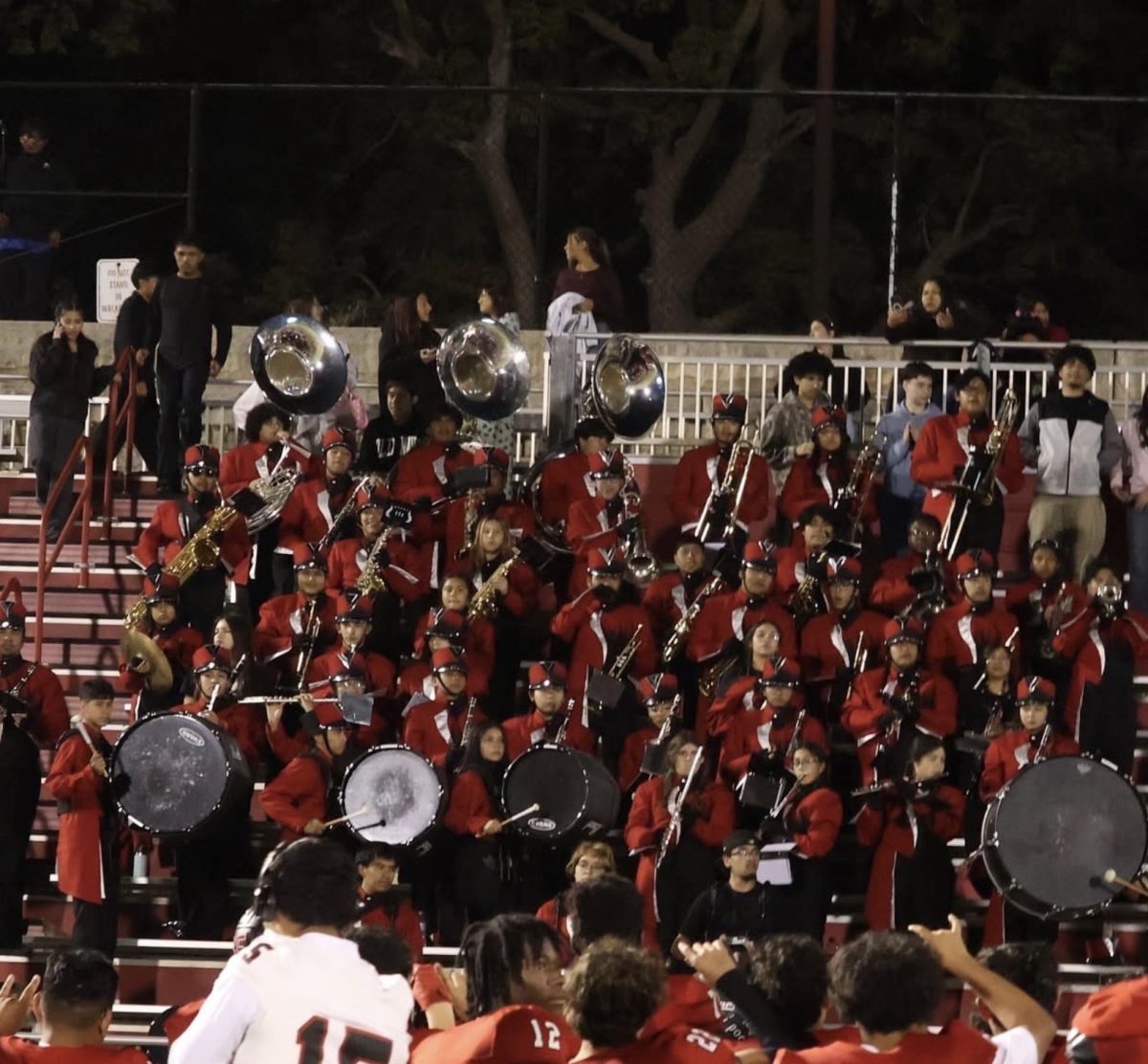The South High marching band performs at a football game in early fall.