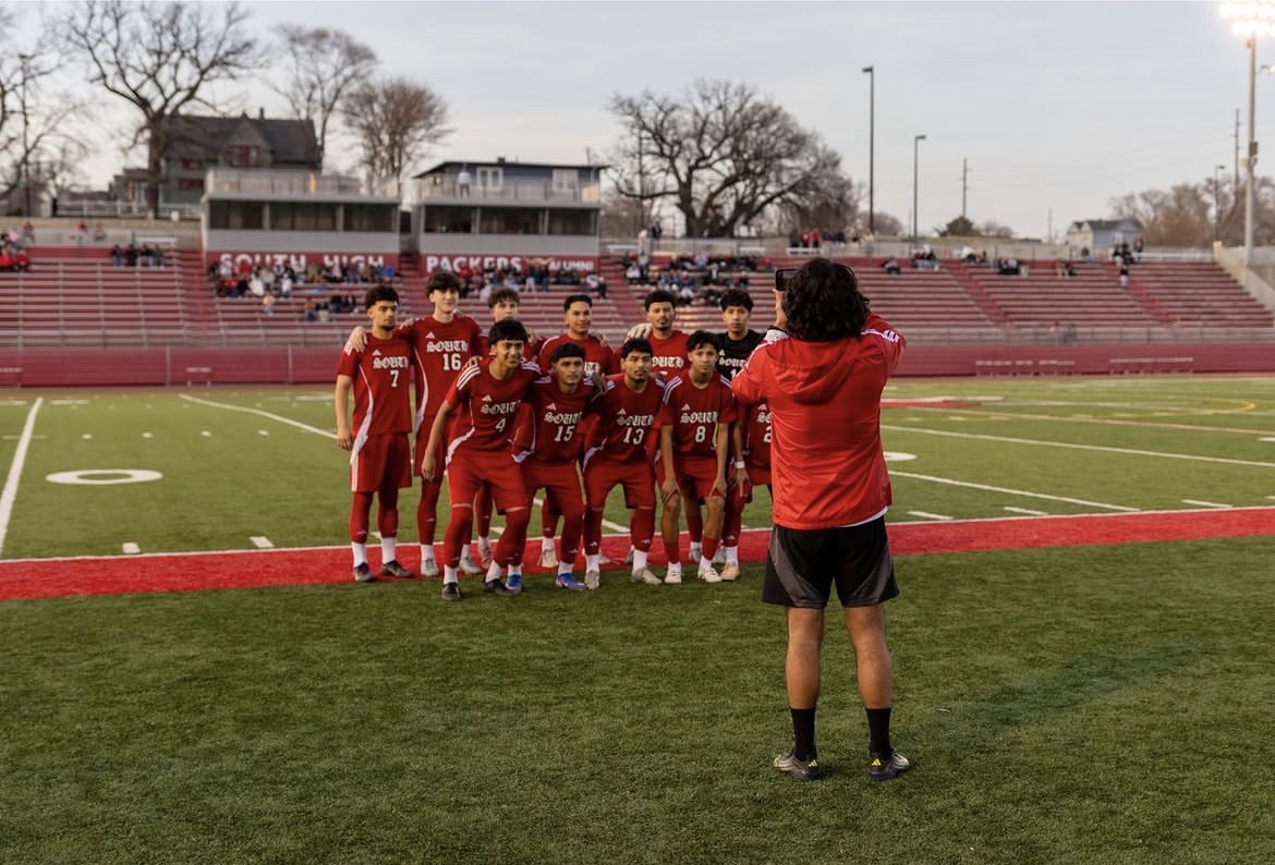 Coach Vasquez takes a picture of the starting 11.